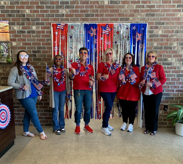 Summerville employees dressed in red, white, and blue to celebrate America's 250th
