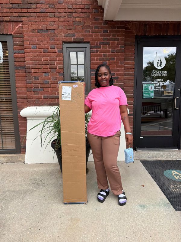 Hammock winner holding boxed hammock