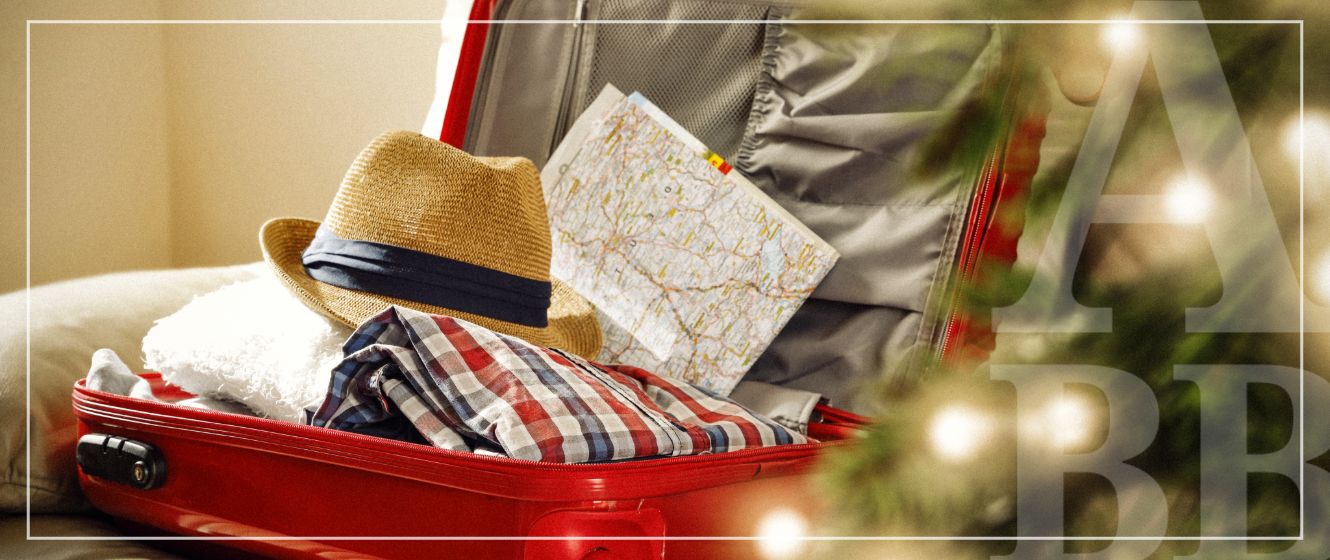 Red suitcase packed for holiday travel