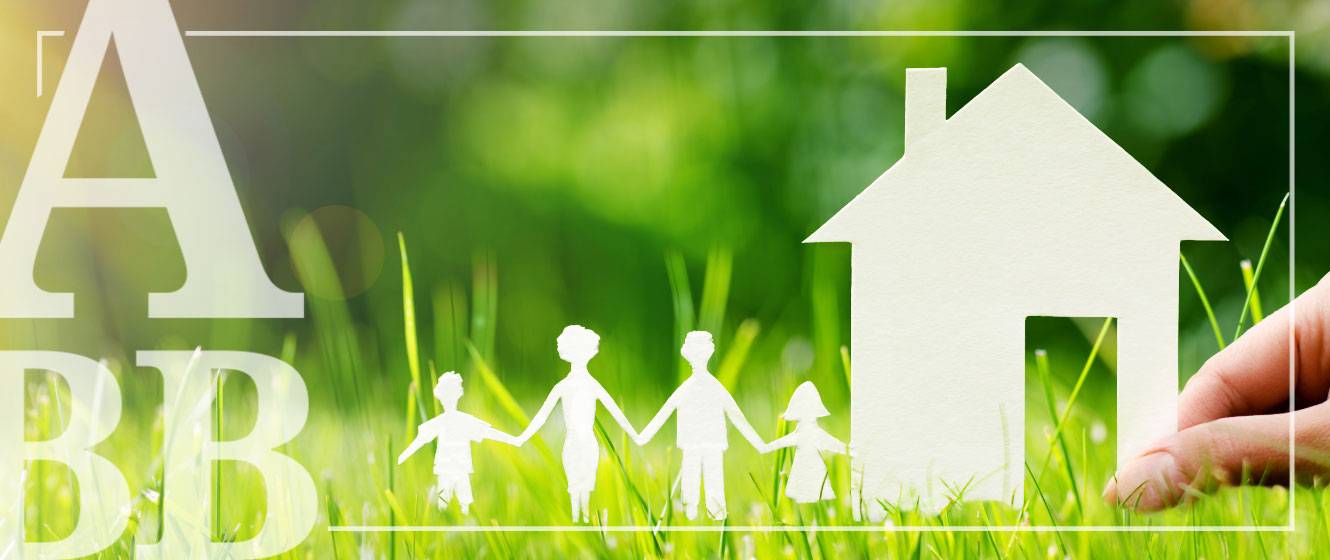 Paper cut out of family and house