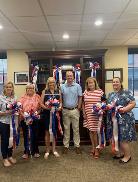 Mullins Main employees dressed in red, white, and blue to celebrate America's 250th birthday