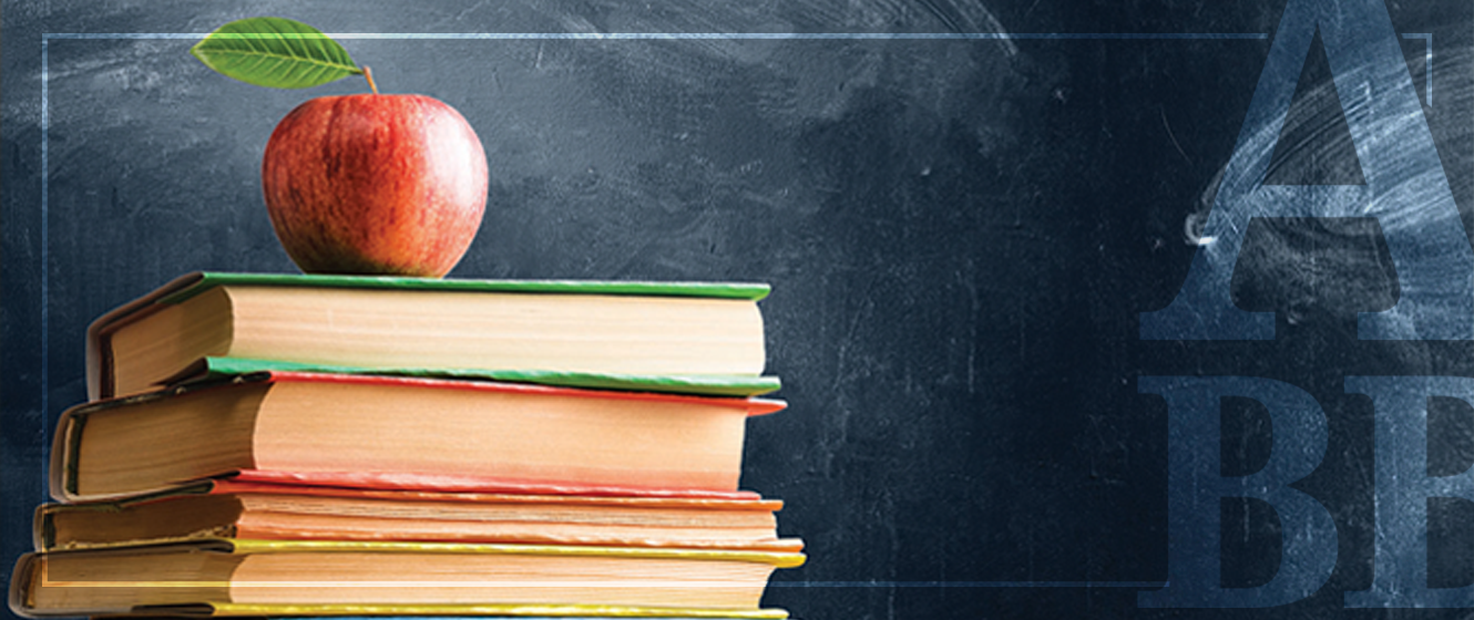 Apple on top of a stack of books with a chalkboard background.