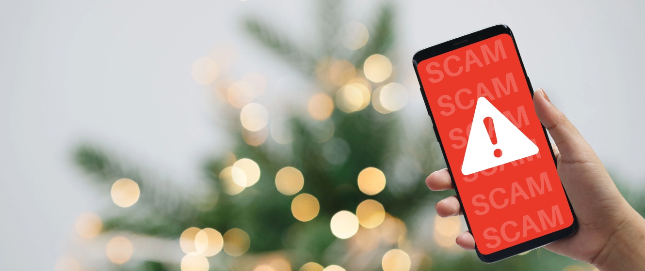 A smartphone showing a warning sign indicating a scam alert