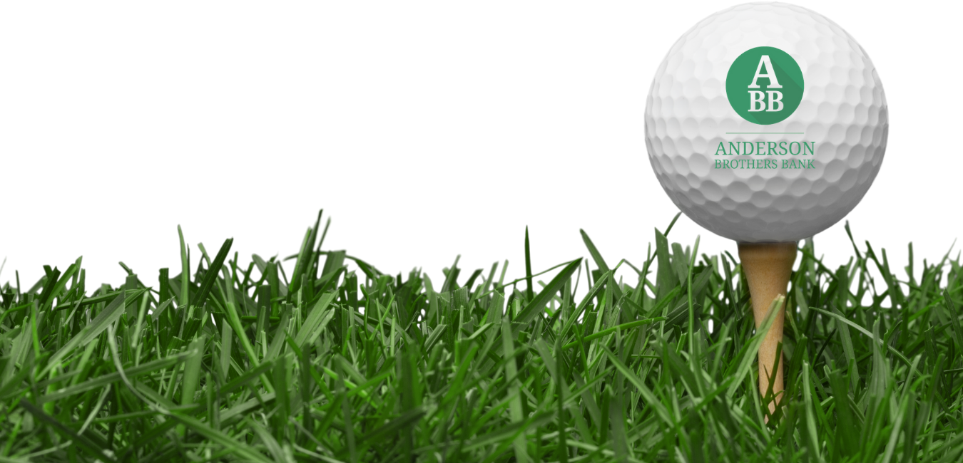 Golf ball on tee in grass.